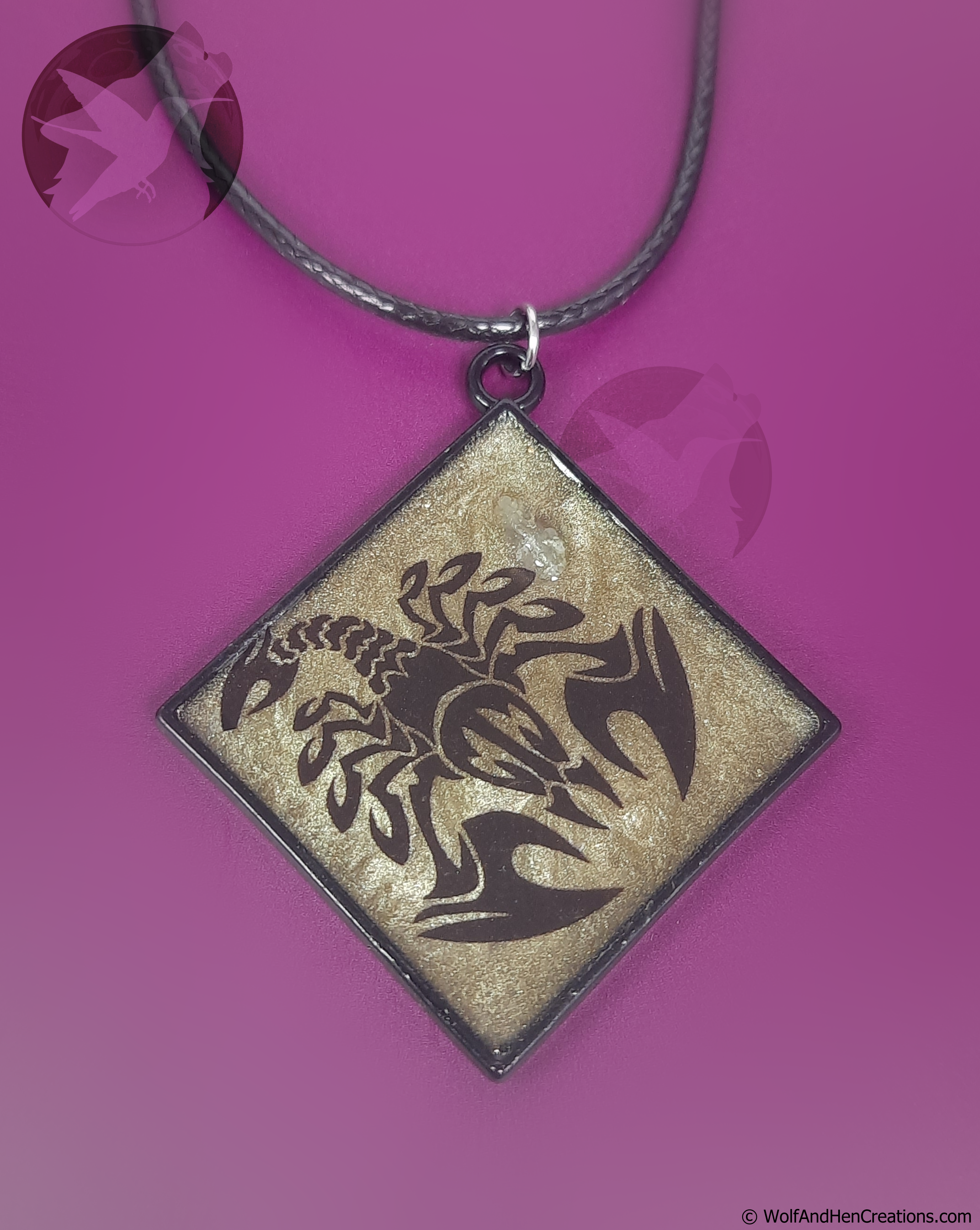 Square pendant with dragon design on a purple background