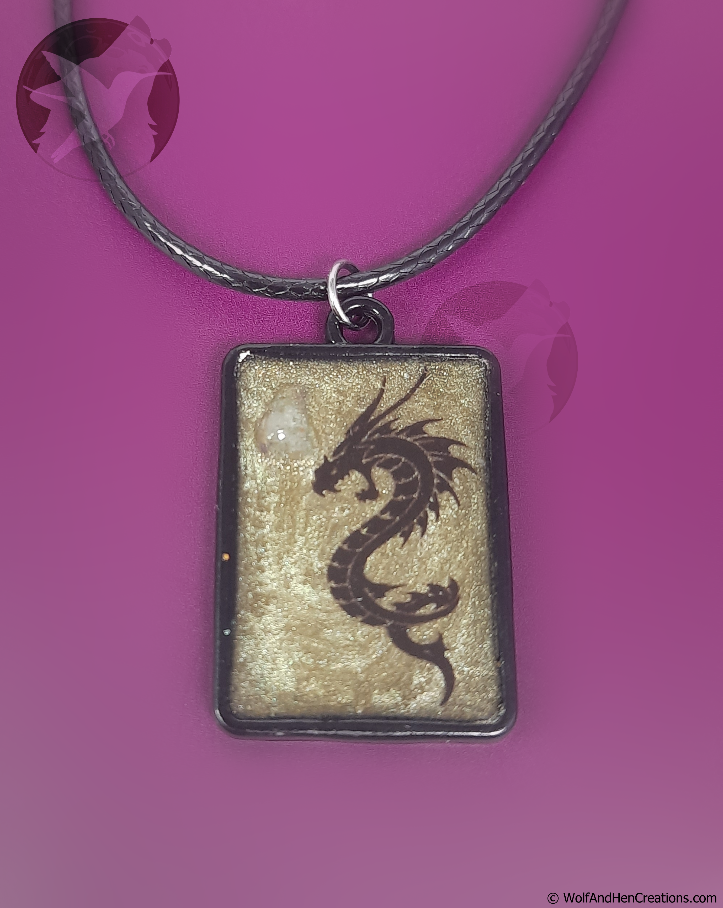 Dragon pendant necklace on a purple background