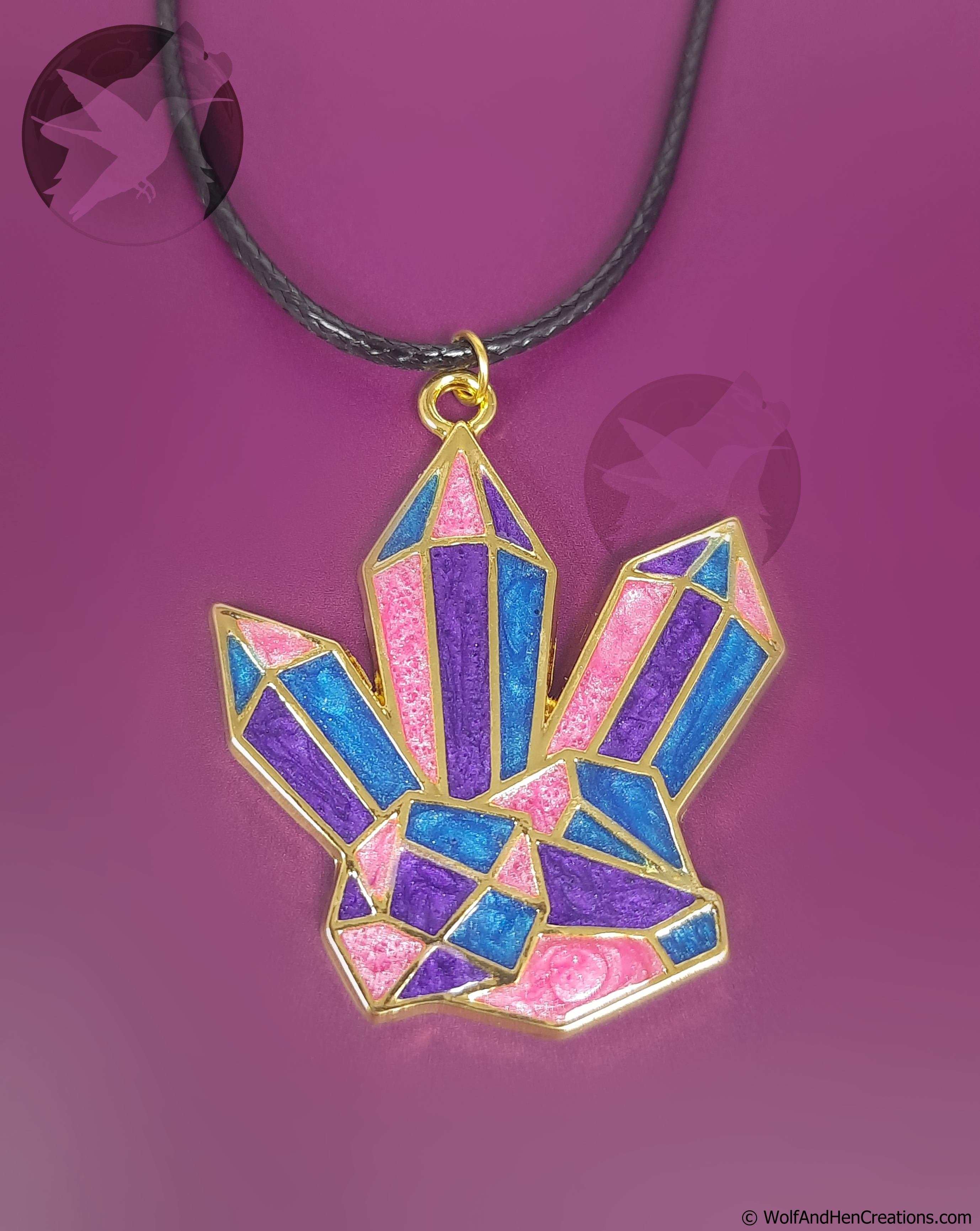 Colorful crystal pendant on a purple background